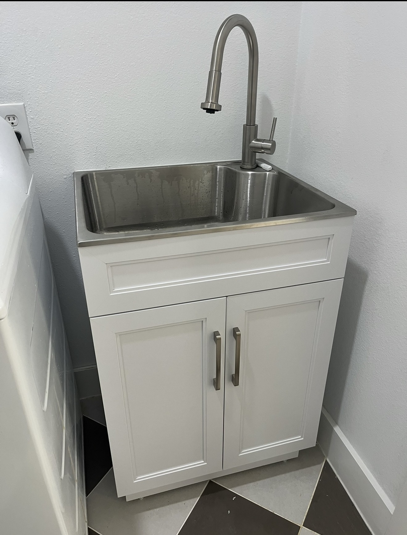 Utility sink and cabinet installation